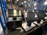a lot of computers that are sitting on a table
