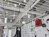 many electrical equipment hanging from the ceiling of a building