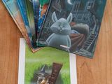 five children ' s books sitting on a wooden table next to each other