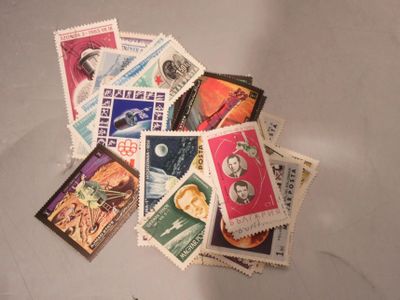 a pile of stamps that are on a table