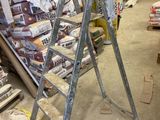 a ladder that is sitting in the middle of a room