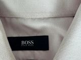 a close up of a white shirt with a black label on it