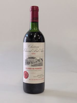 a bottle of wine that is sitting on a table