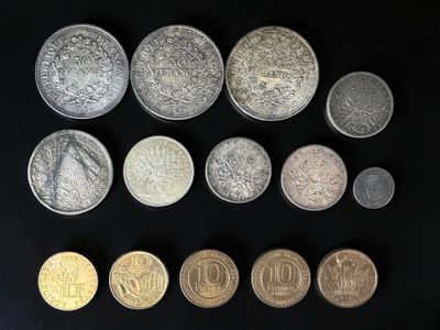 a group of coins sitting on top of a black surface