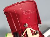 a red cell phone that is sitting on a table