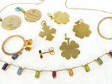 many different necklaces and bracelets that are on a table