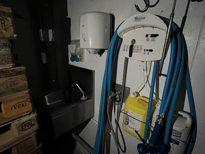 a water heater and a sink in a room