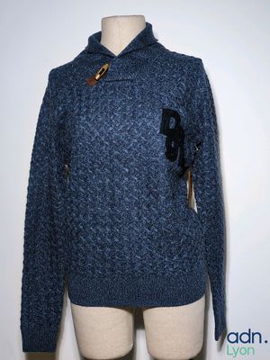 an image of a blue sweater with a bow on it