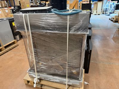 a pallet with a bunch of boxes on it in a warehouse