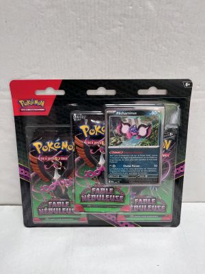two pokemon cards are in a package on a white surface