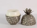two pineapples sitting next to each other on a table