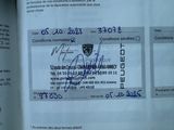 a close up of a document with a picture of a person ' s name on it