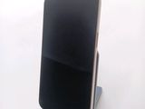 a cell phone that is sitting on a stand