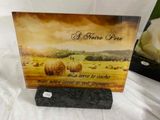 a card with a picture of a field and a rose on it