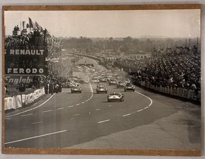 many cars that are racing down a race track