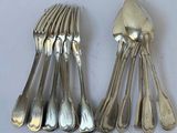five spoons and a fork on the table