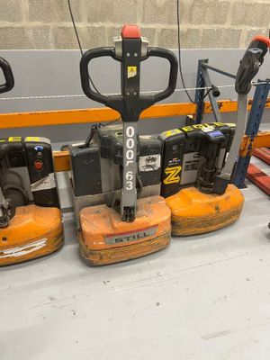 a lot of different types of forklifts on the floor