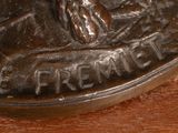 a close up of a bronze coin with a bird on it