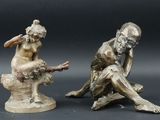 paire de figurines anciennes en bronze représentant un homme et une femme