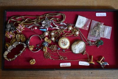 a display case with a lot of jewelry in it