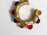 an image of a close up of a ring with beads on it