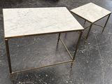 pair of marble and brass side tables on casteors