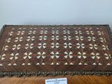 a wooden table with a decorative pattern on it