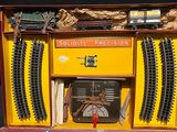 a toy train set in a box on a table
