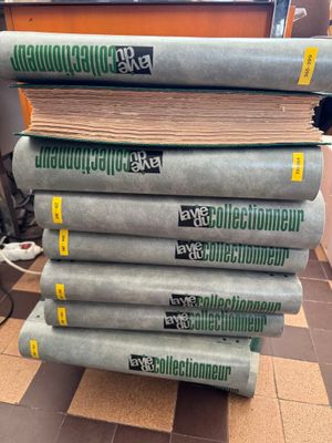 stack of books sitting on top of each other on top of a table