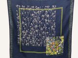 an image of a blue scarf with a floral design
