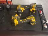 yellow and black power tools sitting on top of a red tool box
