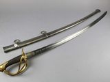 an image of a pair of swords on a white surface
