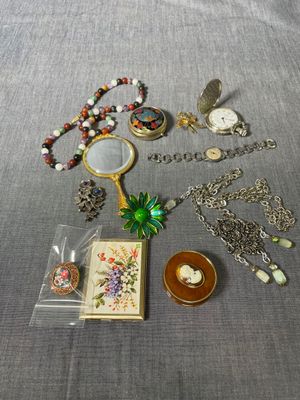 a lot of assorted jewelry on a table