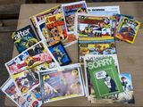 many books on the table with pictures on them
