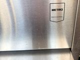 a silver oven that has a metal handle on it