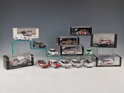 many different models of cars in a display case