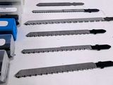 a lot of different types of saws on the table