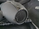 a blow dryer sitting on top of a black bag