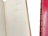 two open books with writing on them sitting next to each other