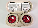 a white box with a red and black game controller inside of it