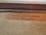 a close up of a piece of wood with writing on it