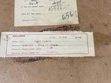 a brown box with a receipt on it and a piece of paper on top of it