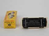 an old black and white photo of a box of cigarettes and a cigarette lighter