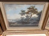 une image d'un tableau sur le mur d'une pièce