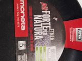 a black frying pan with a red label on it