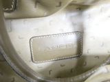 an image of a close up of a handbag with a tag on it