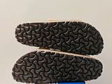 a close up of a pair of shoes on top of a box