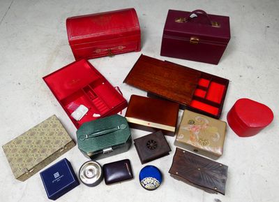 many different types of boxes and cases on the floor