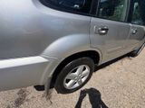 the car is parked on the side of the road in the parking lot