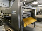 a machine that has a yellow sheet on it